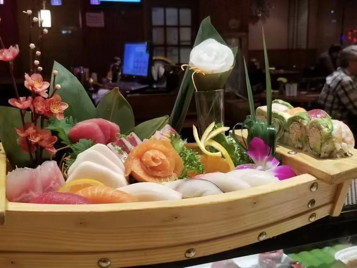 Elegant sushi boat with assorted sashimi and rolls at Extreme Japanese Restaurant in DuBois